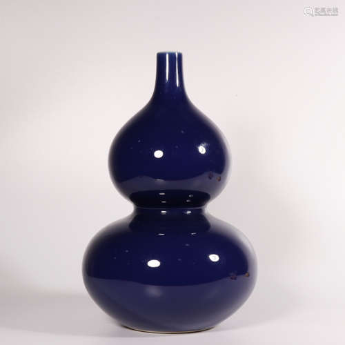 A blue glazed gourd-shaped vase