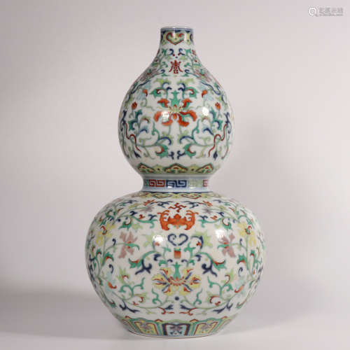 A famille-rose 'floral' gourd-shaped vase