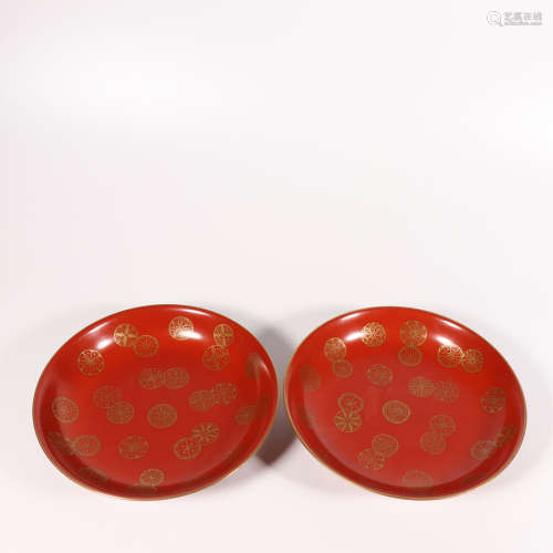 A pair of red glazed plate