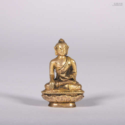 A gilt-bronze statue of Pharmacist Buddha