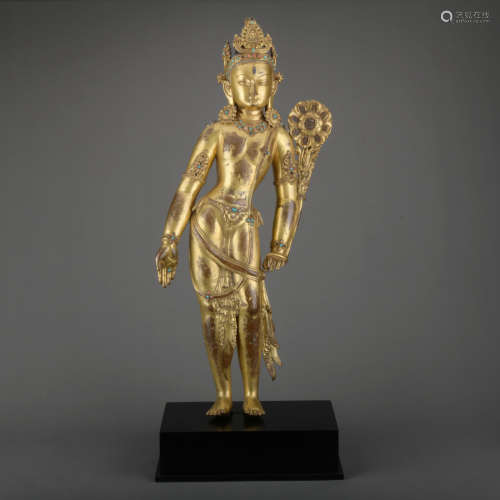 A gilt-bronze statue of Padmapani