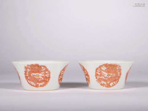 A pair of allite red glazed cup painting in gold