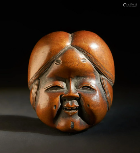 ARTE GIAPPONESE A wooden netsuke carved with a lady's