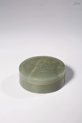 A Chinese carved green celadon jade round box and cover