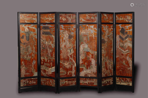 A Chinese six panelled red lacquered screen