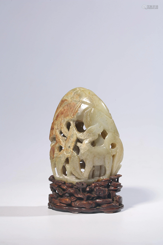 A Chinese celadon and russet jade carving of a mountain