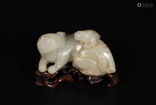 A Chinese jade carving of a mythical beast group