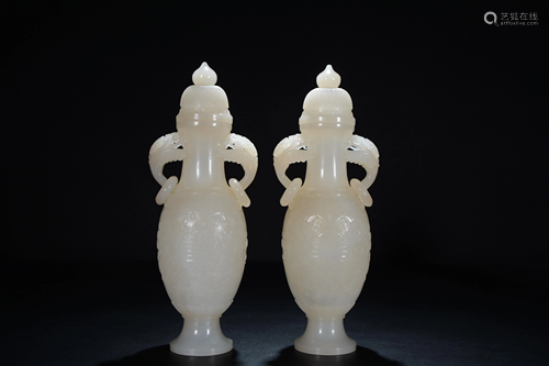 A Chinese green and russet jade carving of a vase