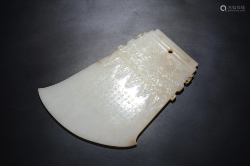 A Chinese white jade carving of an axe