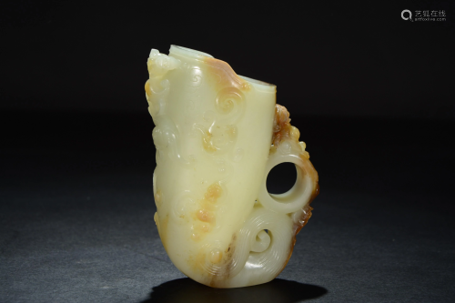 A Chinese celadon and russet jade carving of Jue cup