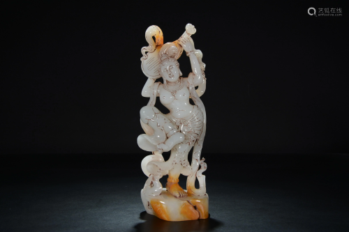 A Chinese russet and pale celadon jade carving of a