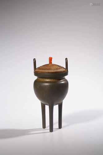 A Chinese tripod incense burner