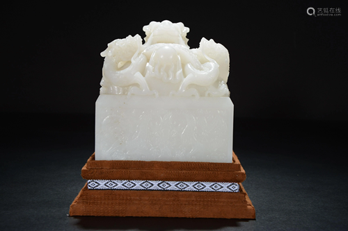 A Chinese carved white jade seal