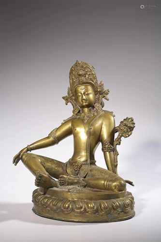 A gilt bronze seated Avalokitesvara on a lotus base