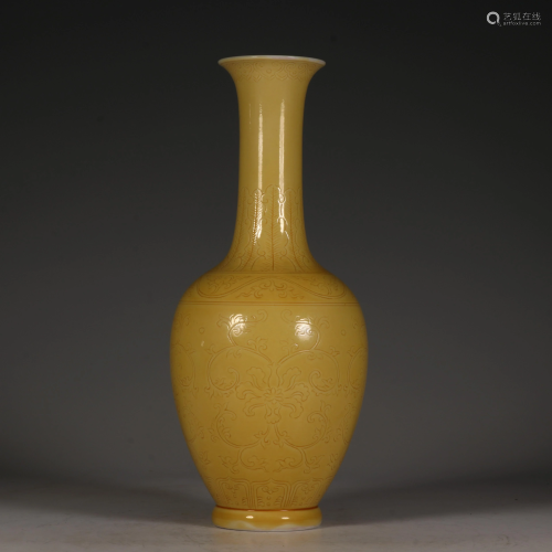 A Chinese incised yellow-glazed bottle vase