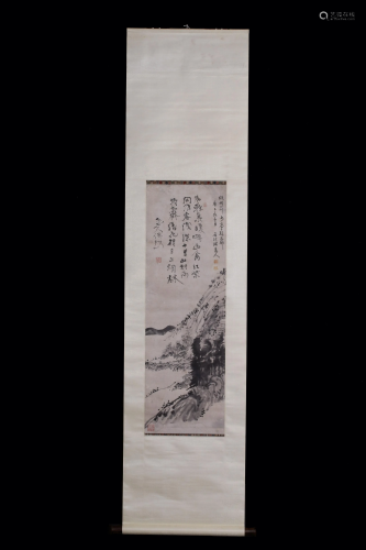 A Chinese scroll depicting a mountainuous scenery