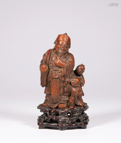 A Chinese carved boxwood figure