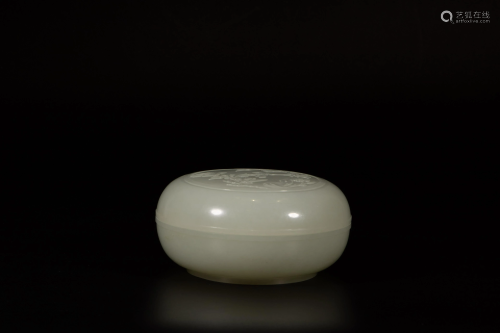 A Chinese finely carved white jade round powder box and