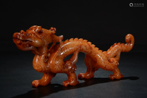 A Chinese russet jade carving of a chilong