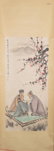 A Chinese scroll depicting scholars in a garden