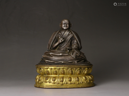A Sino-Tibetan figure of a seated Dalai Lama