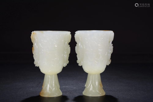 A pair of Chinese carved white jade cups