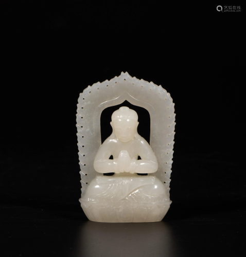 A Chinese white jade carving of a Buddhist figure