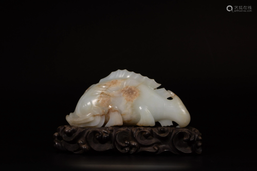 A Chinese russet and white jade carving of a carp