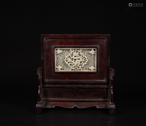 A hardwood table screen with a carved white jade plaque