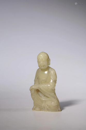 A Chinese Shoushan soapstone carving of a seated