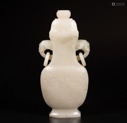 A Chinese carved white jade vase and cover