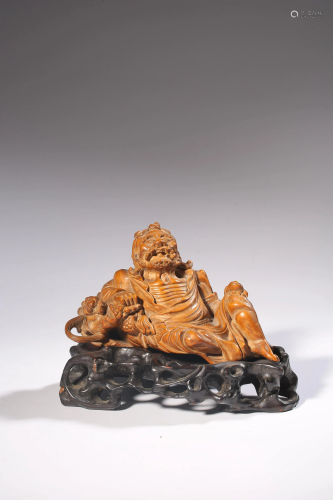A Chinese boxwood figure of a seated Arhat