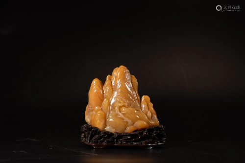 A Chinese yellow soapstone carving of a mountain group