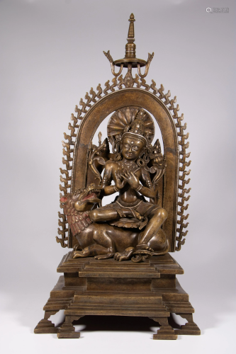 A Sino-Tibetan bronze figure of Vaisravana in a shrine