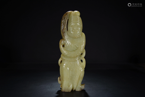 A Chinese green celadon carving of a figure