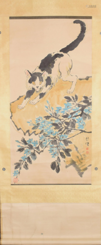 A Chinese scroll depicting a cat in the garden
