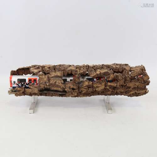 Chris Watson, graffitied tube train in log, mixed media wood...