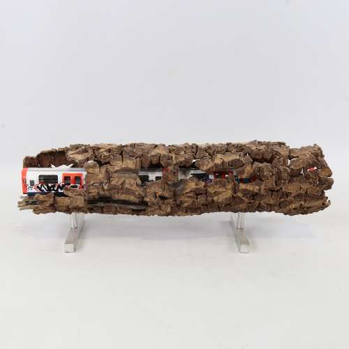Chris Watson, graffitied tube train in log, mixed media wood...