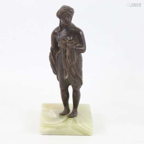 A patinated bronze Classical standing figure on onyx base, h...