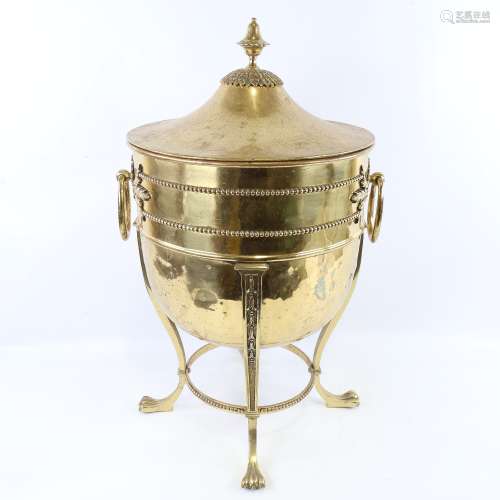 An Edwardian brass urn-shaped coal scuttle, with cast applie...
