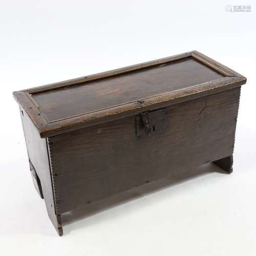 A 17th century oak coffer of small size of plank constructio...