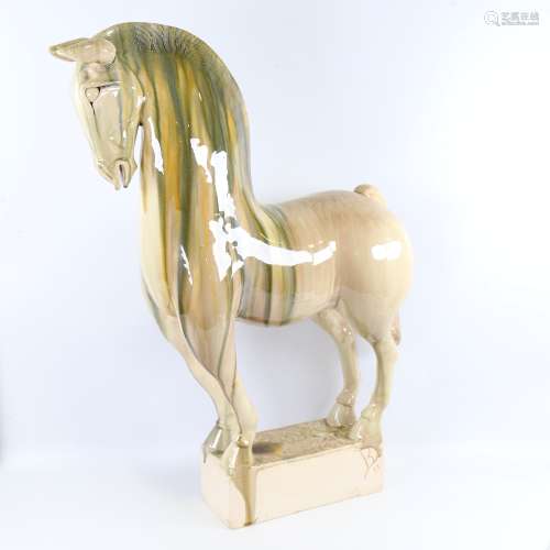 A large treacle glazed Studio pottery Tang style horse, sign...