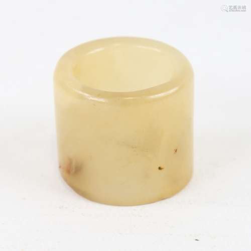 A Chinese polished jade archer's ring, length 27mm, diameter...