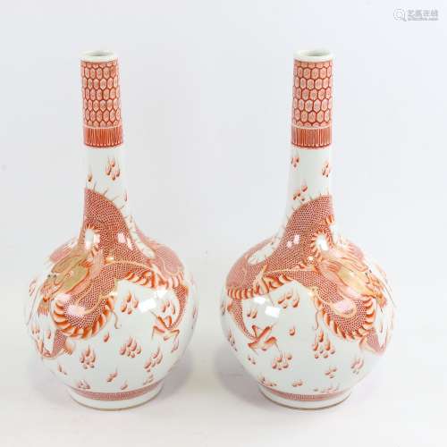 A pair of Chinese white glaze porcelain bottle vases, with h...