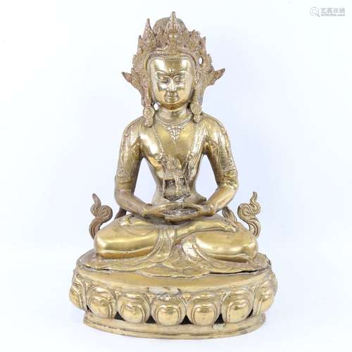 A Chinese gilt-bronze seated Buddha, height 38cm