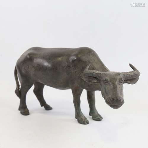 A Chinese patinated bronze water buffalo, length 23cm, heigh...