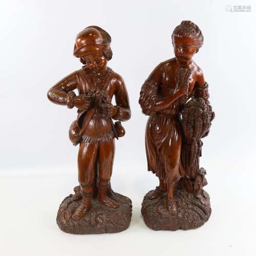 A pair of 19th century carved and stained wood standing harv...