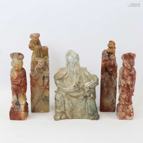 A Chinese carved greenstone crouching figure, height 12cm, a...