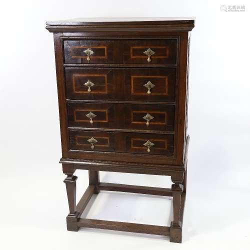 A 17th/18th century oak and walnut chest on stand, with line...