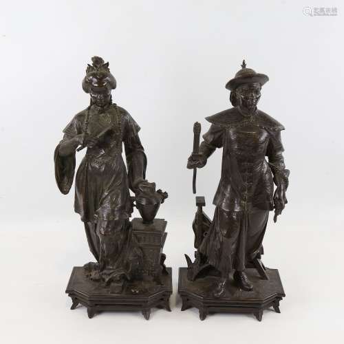 A pair of 19th century French patinated bronze sculptures of...